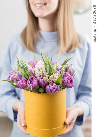 Sunny spring morning. Young happy woman holding a 38720639