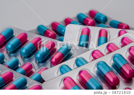 Pile of blue, pink anti fungal capsule pills  38721810