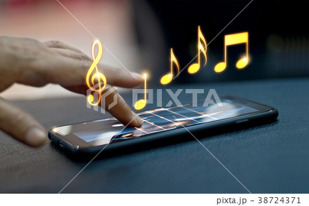 Abstract hand playing music notes on smartphone 38724371