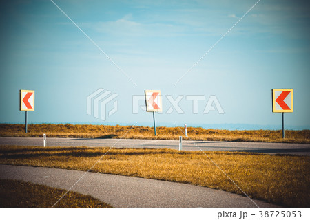 Turn left sign on a country road 38725053