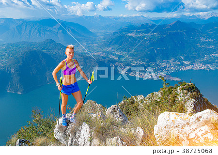 Trail running woman in the mountains 38725068