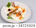 chicken breast with vegetables on a white plate. 38725929