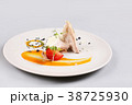 chicken breast with vegetables on a white plate. 38725930