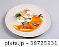 chicken breast with vegetables on a white plate. 38725931