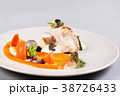chicken breast with vegetables on a white plate. 38726433