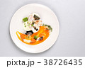 chicken breast with vegetables on a white plate. 38726435