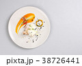 chicken breast with vegetables on a white plate. 38726441