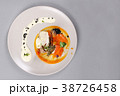 chicken breast with vegetables on a white plate. 38726458