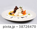 chicken breast with vegetables on a white plate. 38726470