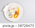 chicken breast with vegetables on a white plate. 38726473