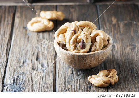 italian tarallo with almonds on the wooden table italian tarallo with almonds on the wooden table 38729323