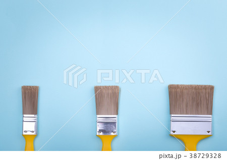 Two brushes for painting on blue paper Two brushes for painting on blue paper 38729328