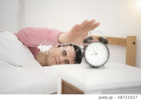 Man wake up doing turn off alarm clock Man wake up doing turn off alarm clock 38731027