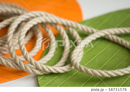 Roll of rough rope on the background 38731576