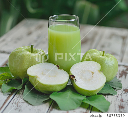 Guava juice and fresh Guava on wooden background 38733339