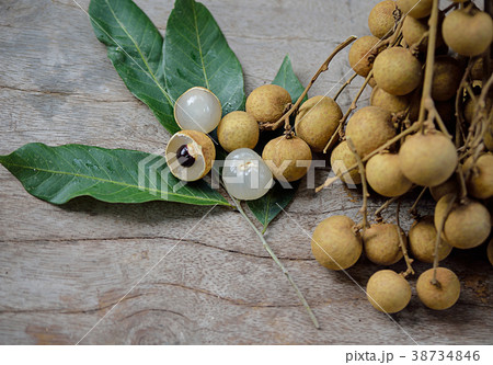 Fresh longan isolated on wooden background Fresh longan isolated on wooden background 38734846