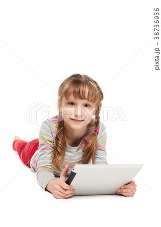 Girl lying on the floor with tablet computer 38736936