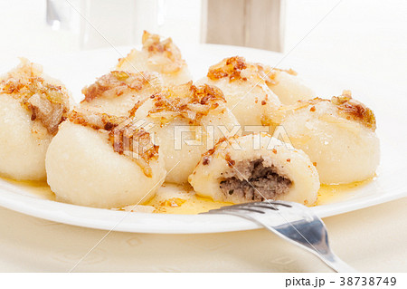 Meat stuffed dumplings with fried onion 38738749
