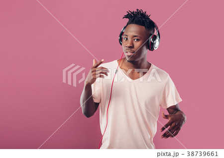 African-American man in headphones listening to African-American man in headphones listening to 38739661