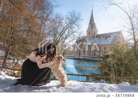 Young woman playing with her dog 38739868