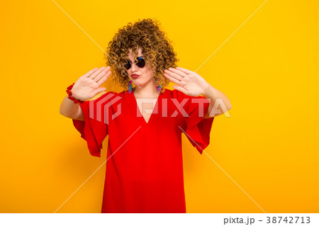 Attractive woman with short curly hair 38742713
