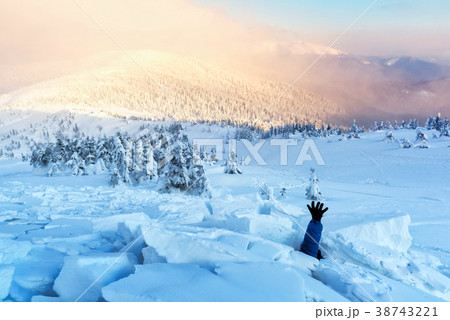 A man covered with a snow avalanche A man covered with a snow avalanche 38743221