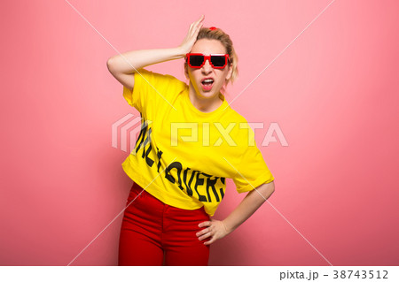 Blonde woman in bright clothes Blonde woman in bright clothes 38743512