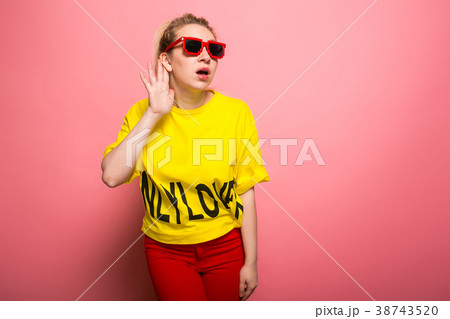 Blonde woman in bright clothes Blonde woman in bright clothes 38743520