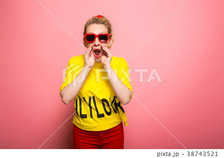 Blonde woman in bright clothes Blonde woman in bright clothes 38743521