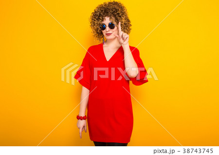 Attractive woman with short curly hair Attractive woman with short curly hair 38743745