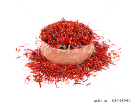 Saffron spice in wood bowl isolated on white Saffron spice in wood bowl isolated on white 38743940