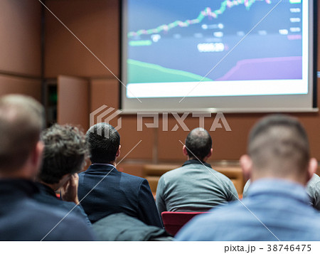Audience in conference hall listening to 38746475