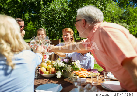 happy family having dinner or summer garden party 38747164