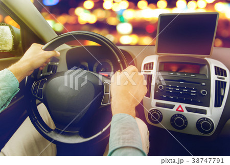 close up of young man with tablet pc driving car 38747791