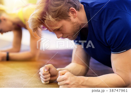 close up of man at training doing plank in gym close up of man at training doing plank in gym 38747961