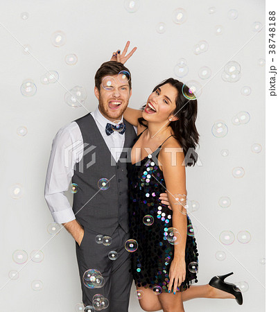 happy couple hugging in soap bubbles at party happy couple hugging in soap bubbles at party 38748188