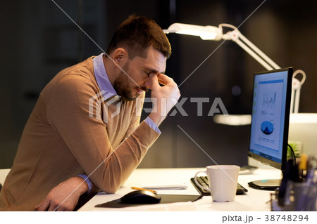 tired businessman working at night office tired businessman working at night office 38748294