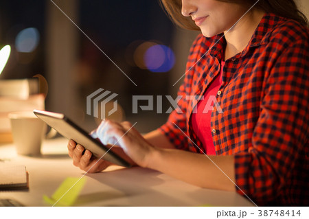close up of student woman with tablet pc at home close up of student woman with tablet pc at home 38748414