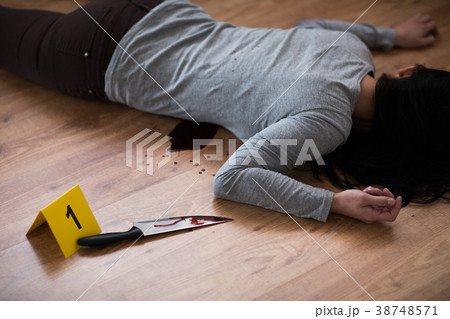 dead woman body lying on floor at crime scene dead woman body lying on floor at crime scene 38748571