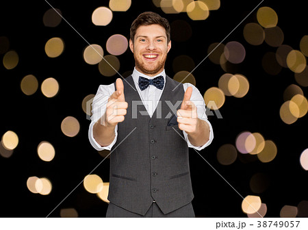 happy man in festive suit pointing in camera happy man in festive suit pointing in camera 38749057