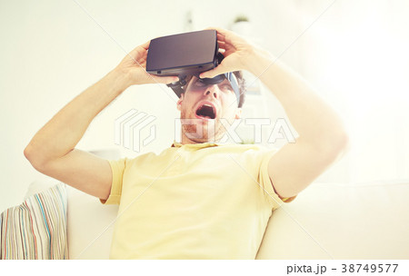 young man in virtual reality headset or 3d glasses young man in virtual reality headset or 3d glasses 38749577