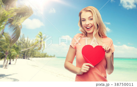 happy woman or teen girl with red heart shape happy woman or teen girl with red heart shape 38750011