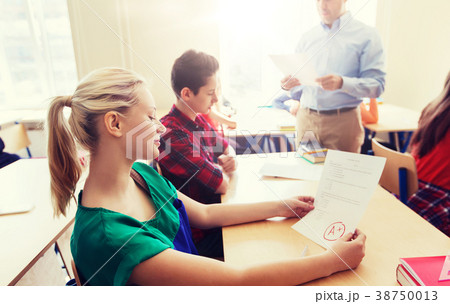 group of students and teacher with test results 38750013
