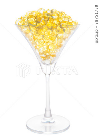 Fish oil capsule in cocktail glass with path  38751759