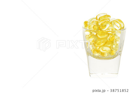 Fish oil soft capsule in glass with clipping path 38751852