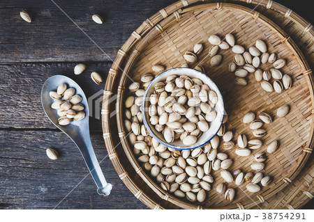 Pistachio nuts on the old wood Pistachio nuts on the old wood 38754291