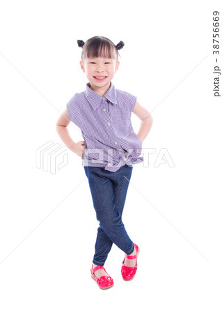 Little girl smiling while standing over white  38756669