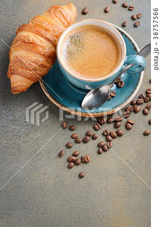Cup of fresh coffee with croissant. Cup of fresh coffee with croissant. 38757566