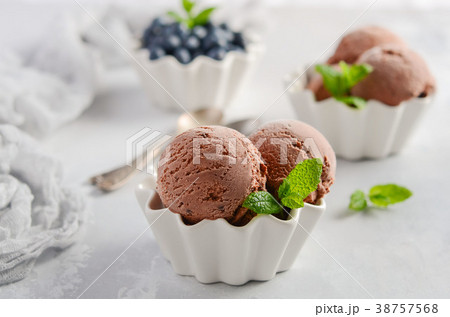 Chocolate ice cream with blueberries. 38757568