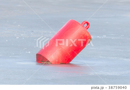 Red buoy in a large pond 38759040